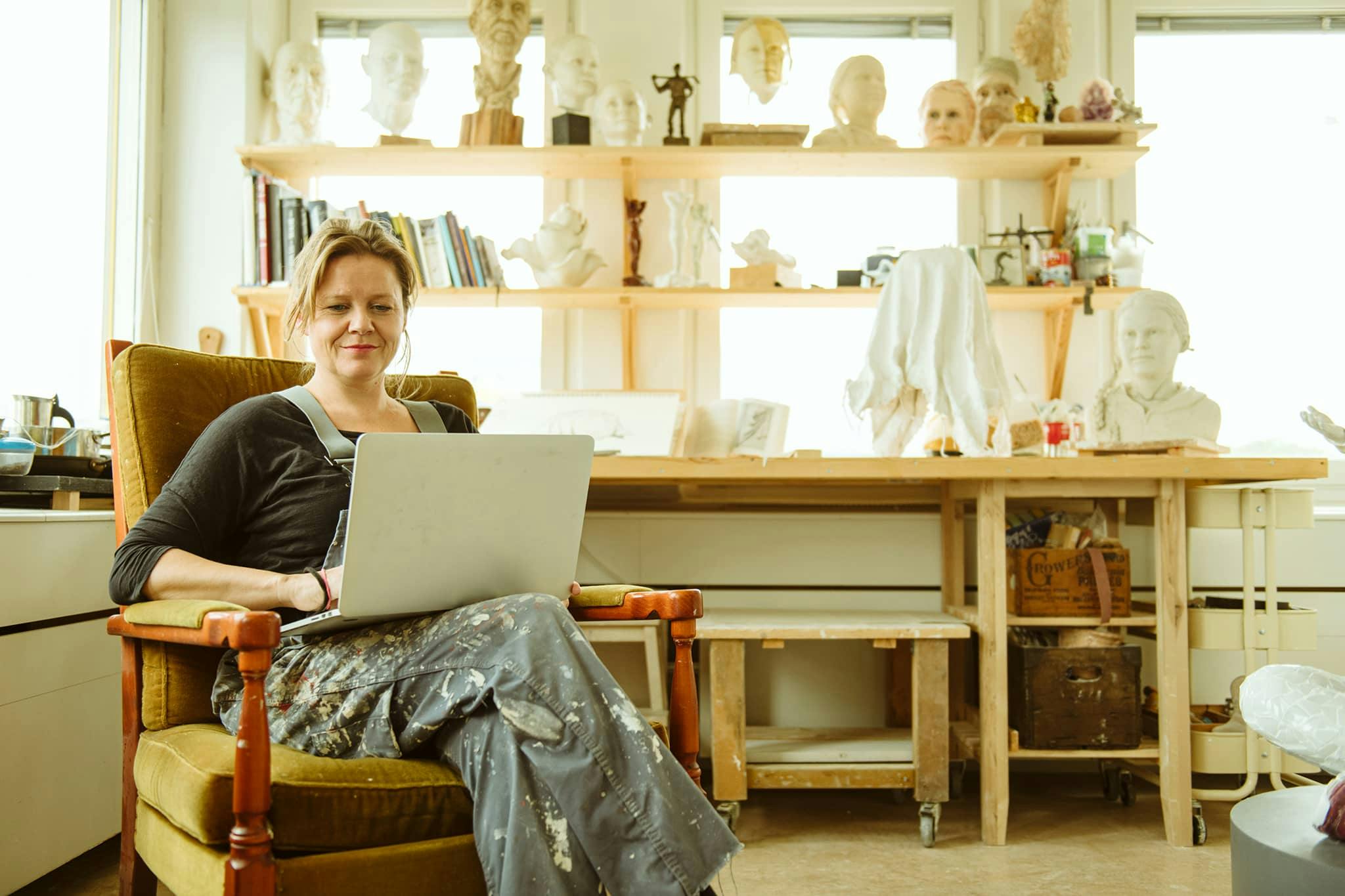 woman artist laptop entrepreneur happy
